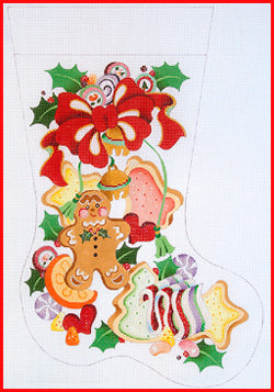 Decorative Christmas stocking with gingerbread men, candy canes, and holly leaves on a white background.