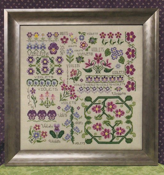 Dreaming of Violets, from, Rosewood Manor, features a collection of blooming colorful flowers.